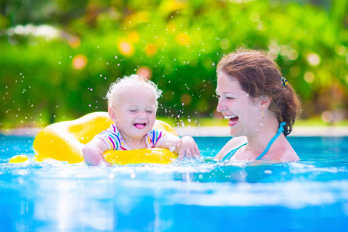 Mother and baby in swiming pool