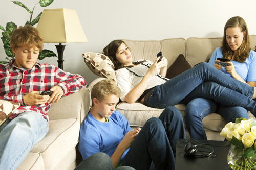 teens relaxing on phones 
