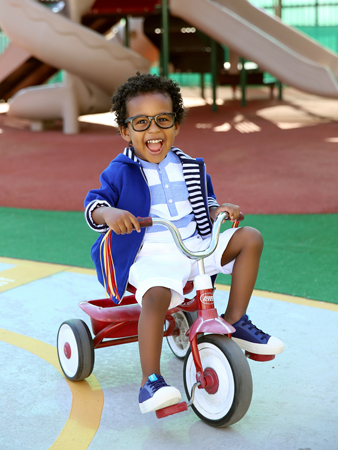 Ryan Morris II riding tricycle