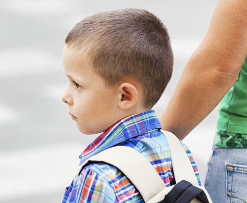 boy waiting with parent