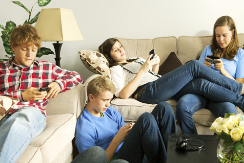 teens relaxing on phones