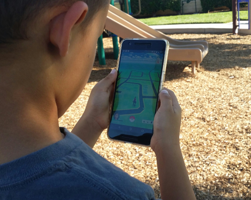 child playing Pokemon Go