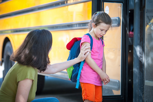 worried girl getting on bus