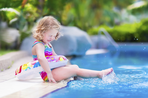 young girl poolside