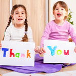 girls with thank you sign Thumbnail