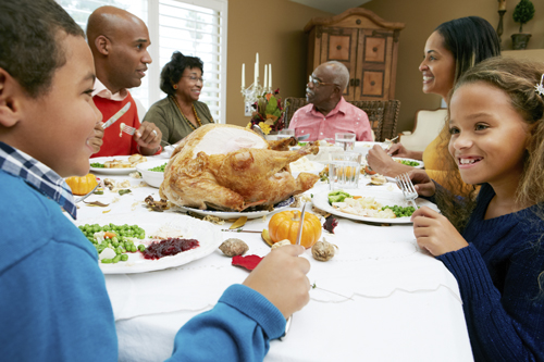 family eating Thanksgiving meal