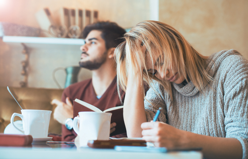 woman working and man reading