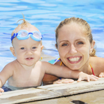 mother and baby boy with googles at swimming pool Thumbnail