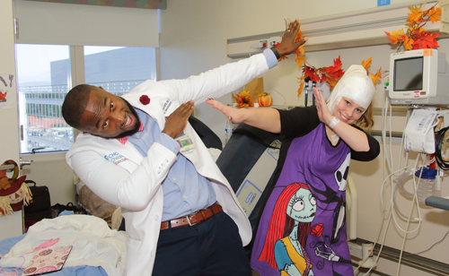 Dancing doctor Tony Adkins dabs with patient Sarah Faulkner