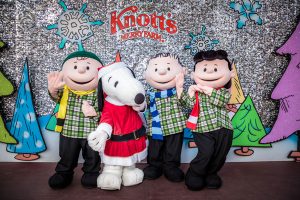 A group of Charlie Brown characters pose together during Christmas