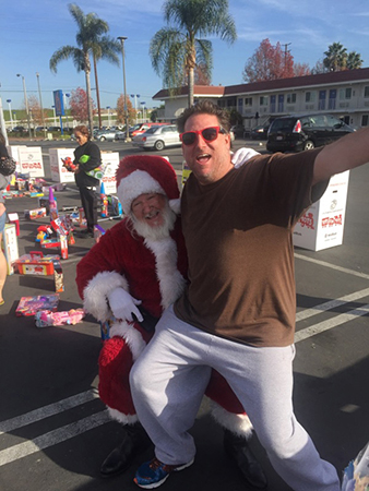 Daniel Barrett hangs out with Santa at last year's Christmas toy drive-Courtesy of Kids Give to Kids