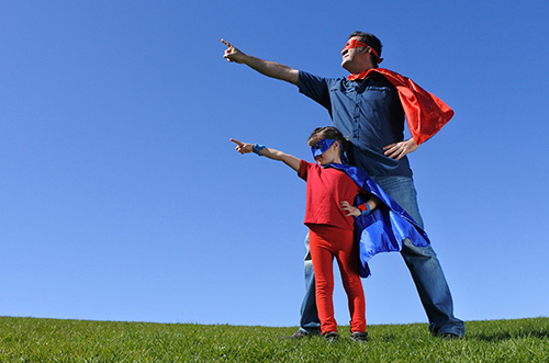 son and dad dressed up as super hero