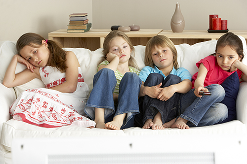 Young Children Watching Television at Home