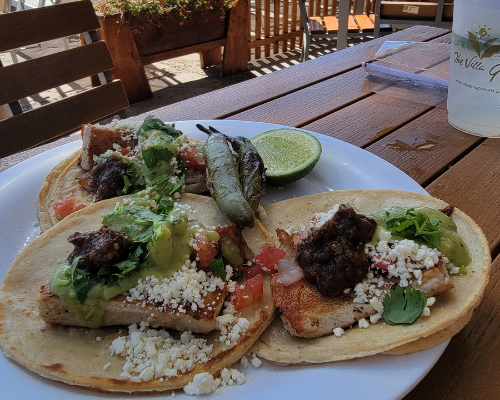 Fish tacos at Villa del Palmar, with the tip of Baja, called Land’s End, in the background