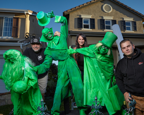 Mike Stanley, Dawn Stanley, and Wyatt Stanley pose with their Halloween decor