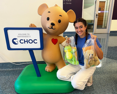 Brooke Walker delivers a donation of Higgy Bears to CHOC