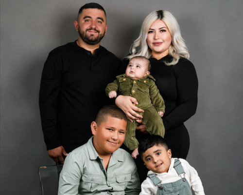 Karina Benitez with her family in a photo studio
