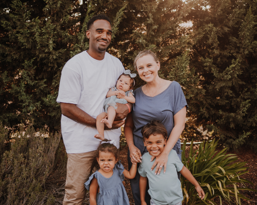 Savannah Foster Family Photo with kids and greenery background