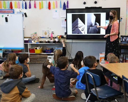 A group of students listening to their teacher at a school in Laguna Beach Unified School District.