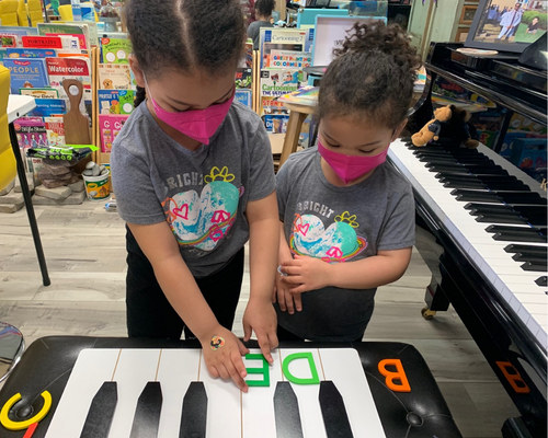 Two girls learning piano keysSounds of Color Studio-Courtesy of Bri Harb
