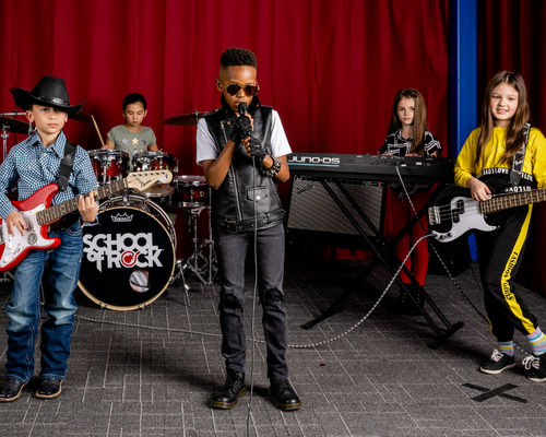 kids jamming at School of Rock band camp