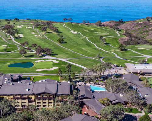 An aerial view above the Lodge, the golf course and the Pacific.