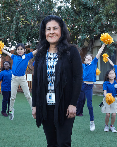 Patty Fabian Top Employee of Orange County with students at Vibrant Minds Charter School