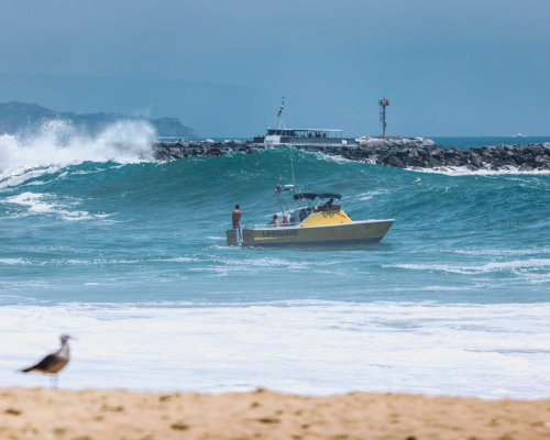 Lifeguard Boat in the distance at Newport Beach
