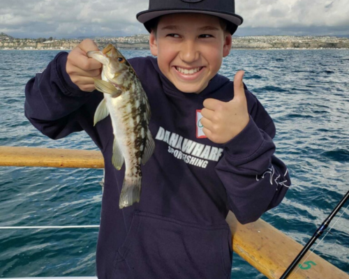 boy holding fishing