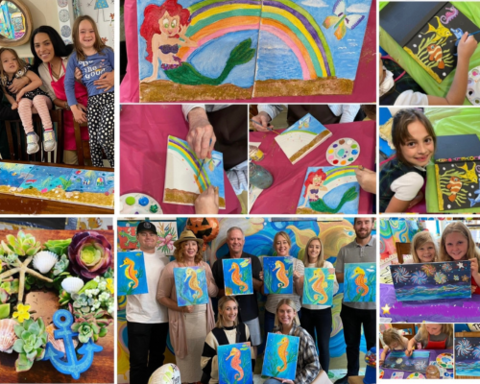 Children and families display their artwork. 