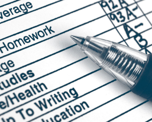 pen resting on report card