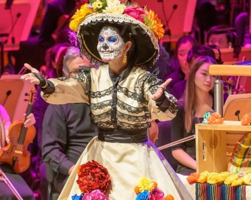 A woman in Day of the Dead costume and makeup at the Pacific Symphony and Segerstrom Center for the Arts