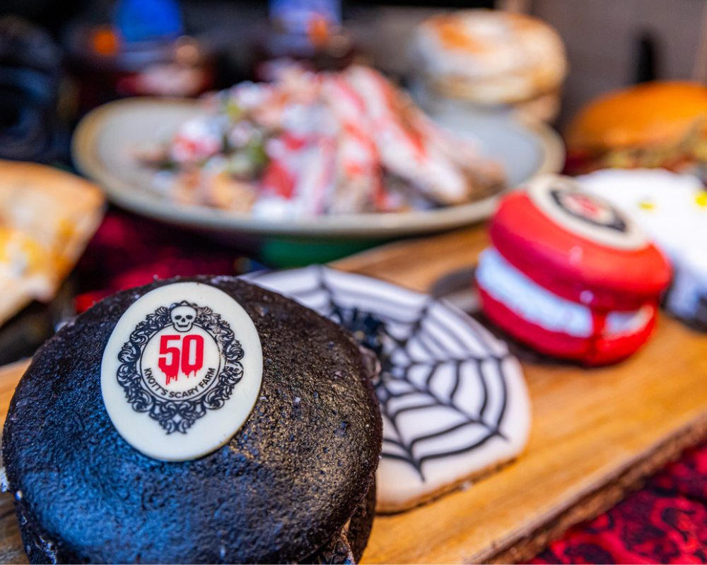 Black and Red Hero Macaroon with a 50 Knott's Scary Farm edible decoration 