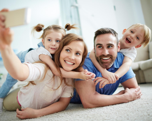 Family of four taking a selfie