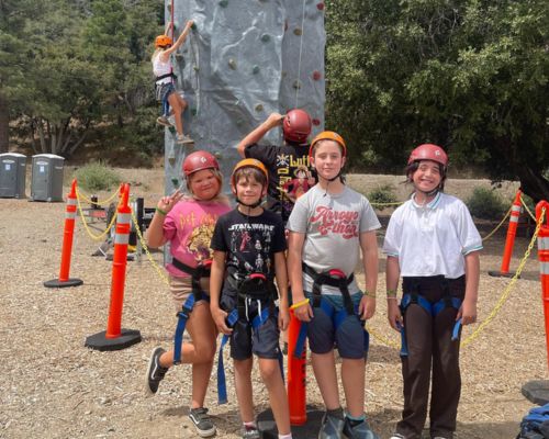 YMCA of Orange County Kid Campers doing rock climbing