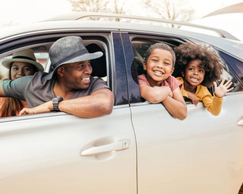 family in car for roadtrip