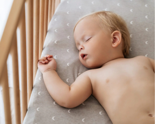 baby sleeping in a crib
