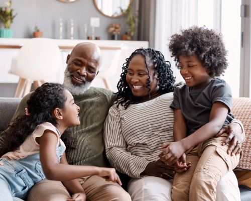 Family sitting on the couch together